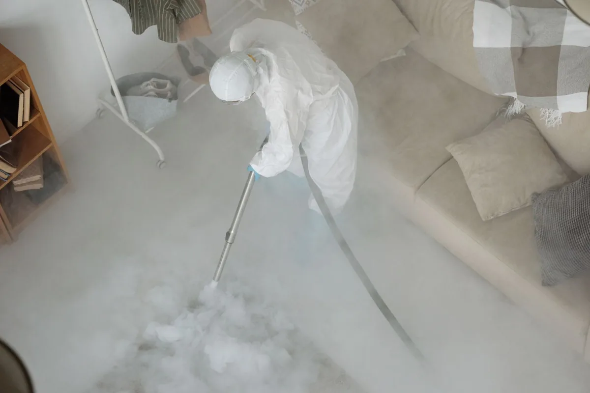 Biohazard cleanup technician in protective equipment, Keystone, CO